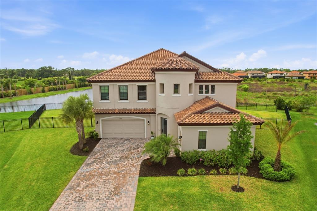 8207 Rushton Place Parrish, FL 34219 - Photo 1 of 65 a front view of a house with a yard
