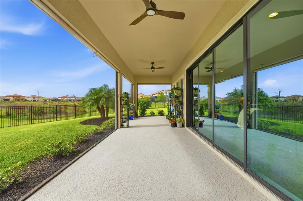 8207 Rushton Place Parrish, FL 34219 - Photo 18 of 65 a view of a porch with a big yard
