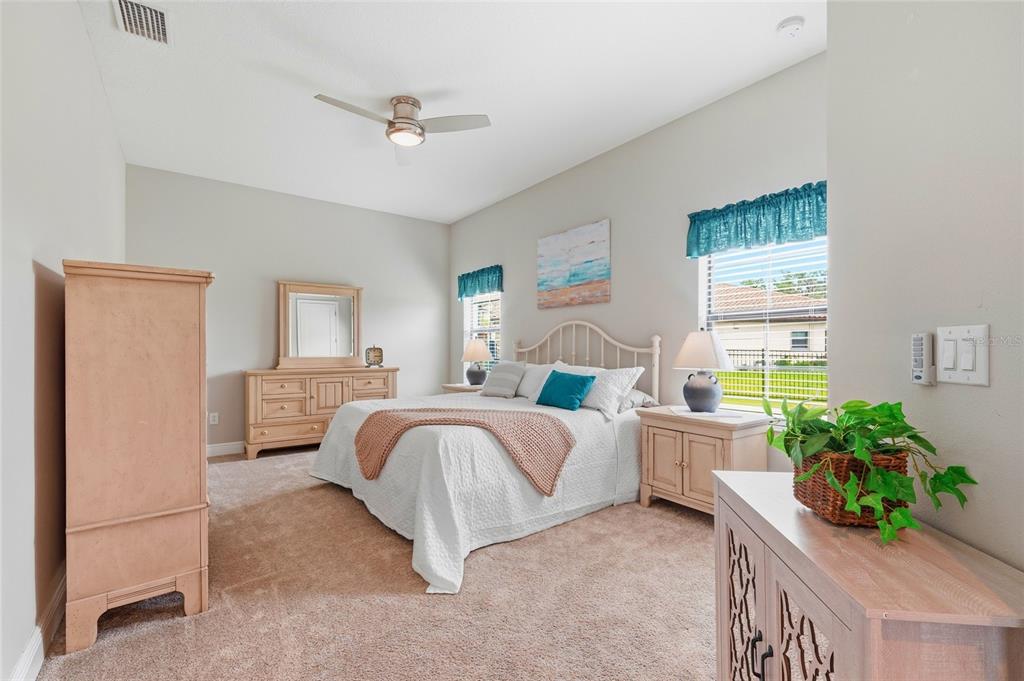 8207 Rushton Place Parrish, FL 34219 - Photo 19 of 65 a bed room with a bed and a window