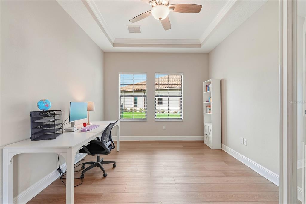 8207 Rushton Place Parrish, FL 34219 - Photo 22 of 65 a view of a workspace with furniture and a window