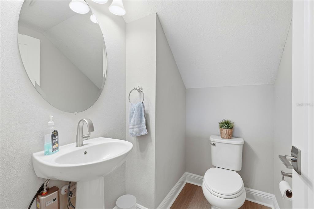 8207 Rushton Place Parrish, FL 34219 - Photo 24 of 65 a bathroom with a sink mirror and toilet