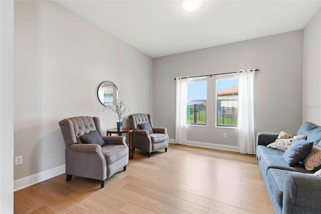 8207 Rushton Place Parrish, FL 34219 - Photo 25 of 65 a living room with furniture and a large window