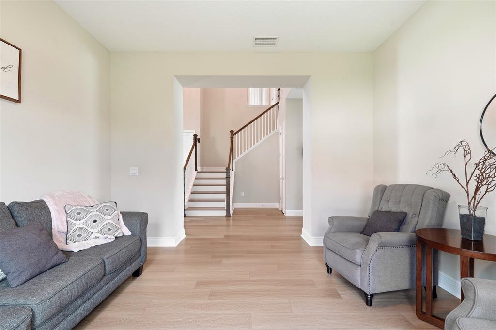 8207 Rushton Place Parrish, FL 34219 - Photo 26 of 65 a living room with furniture and stairs