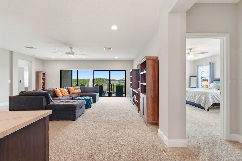 8207 Rushton Place Parrish, FL 34219 - Photo 29 of 65 a living room with furniture a large window and a walk in closet
