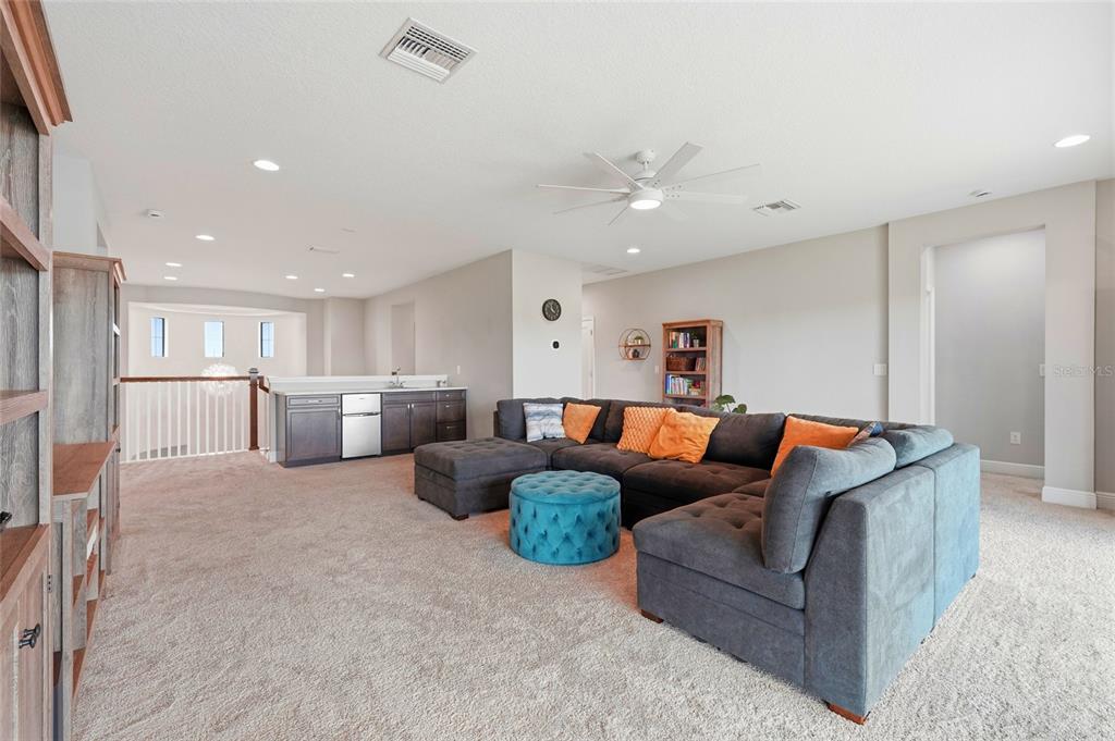 8207 Rushton Place Parrish, FL 34219 - Photo 31 of 65 a living room with furniture and kitchen view