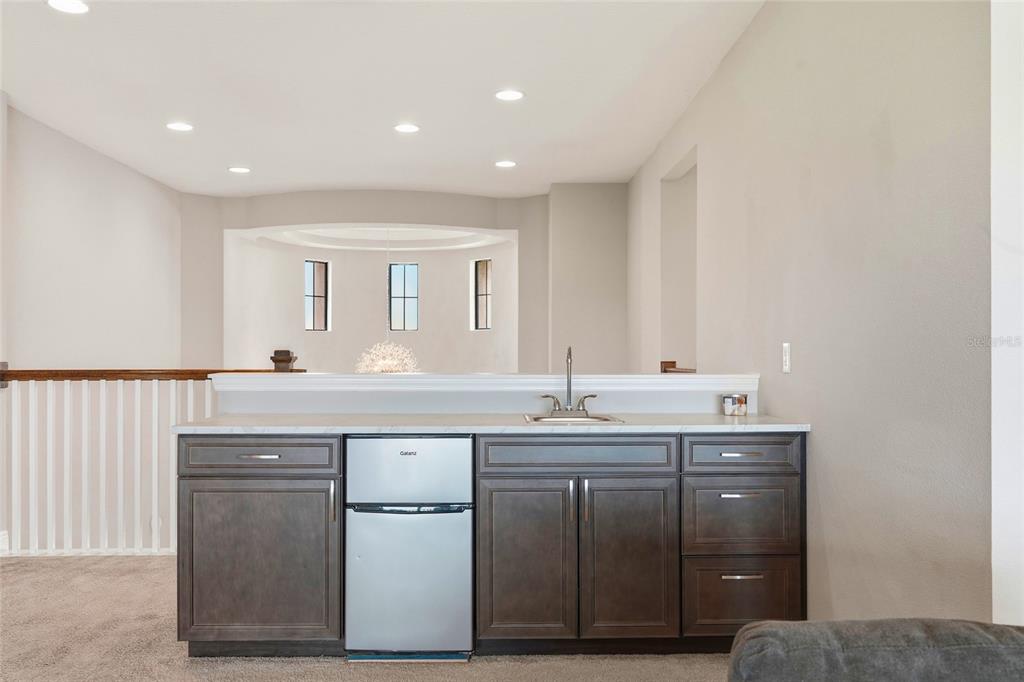 8207 Rushton Place Parrish, FL 34219 - Photo 32 of 65 a kitchen with a sink stove and cabinets