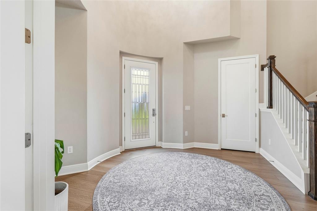 8207 Rushton Place Parrish, FL 34219 - Photo 4 of 65 a view of an entryway with wooden floor