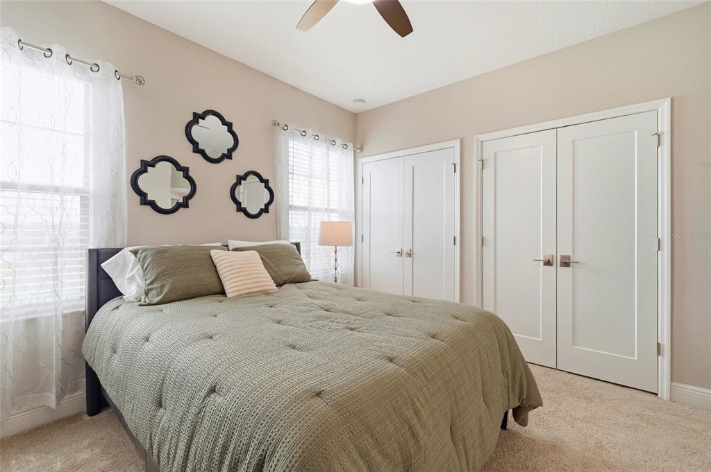8207 Rushton Place Parrish, FL 34219 - Photo 41 of 65 a large bed in a bedroom next to a window