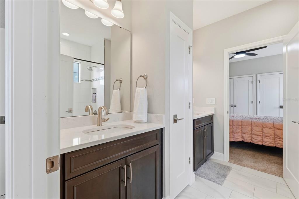 8207 Rushton Place Parrish, FL 34219 - Photo 42 of 65 a en suite bathroom with a sink and a mirror