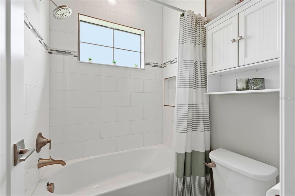 8207 Rushton Place Parrish, FL 34219 - Photo 50 of 65 a bathroom with a toilet and a bathtub