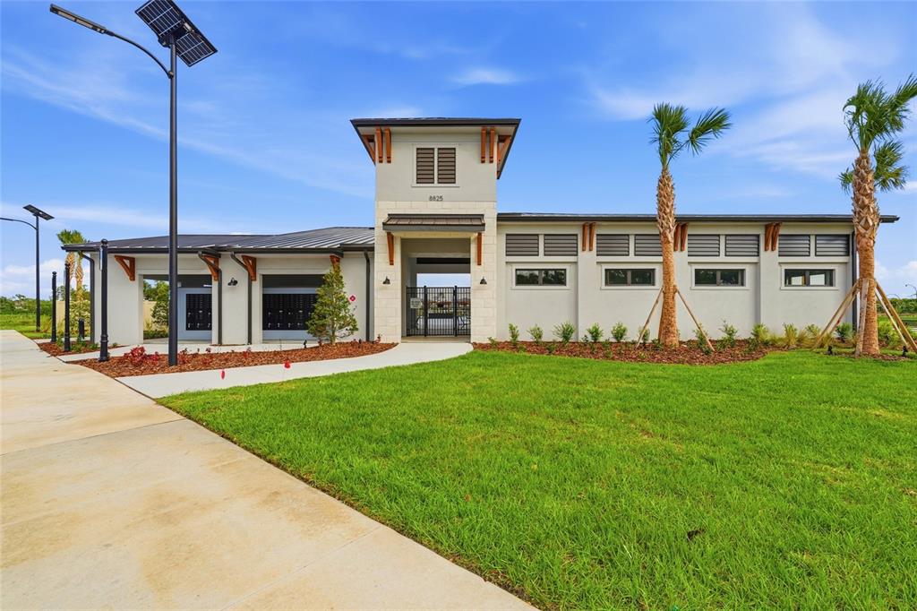 8207 Rushton Place Parrish, FL 34219 - Photo 63 of 65 a front view of a house with a yard