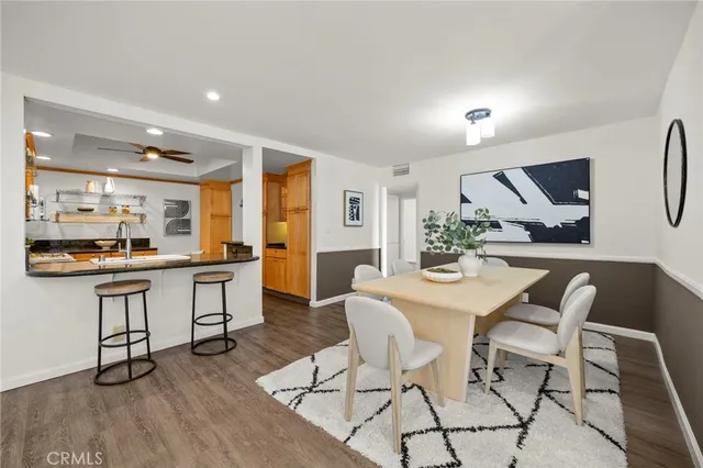 a kitchen with a table and chairs in it