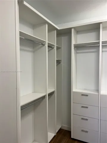 a view of an empty walk in closet