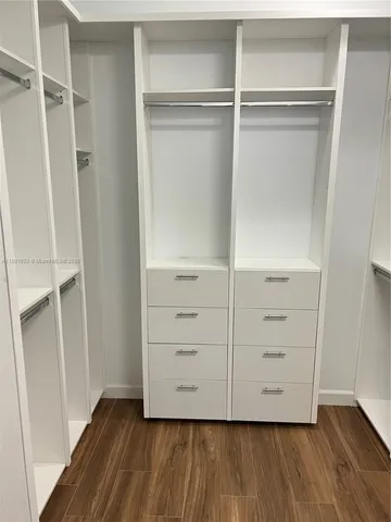 a bathroom with a sink double vanity and a mirror