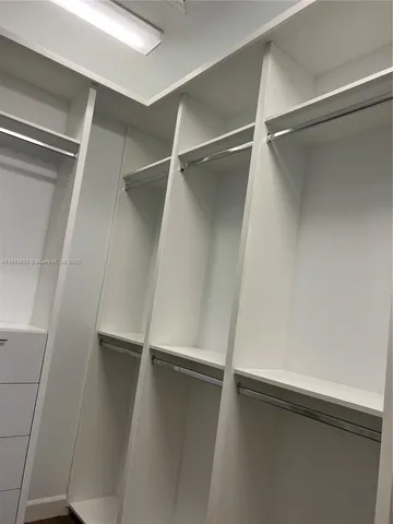 a bathroom with a sink double vanity and a mirror