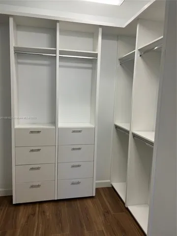 a picture of a room with a fan