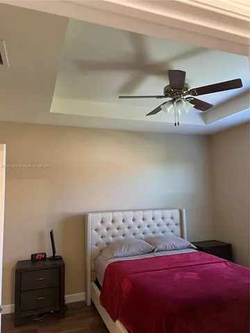 a room with a flat screen tv and a fireplace