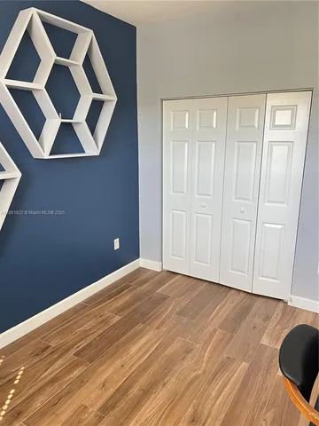 a bathroom with double sink and a mirror