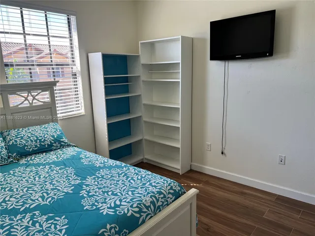 a kitchen with stainless steel appliances and a refrigerator