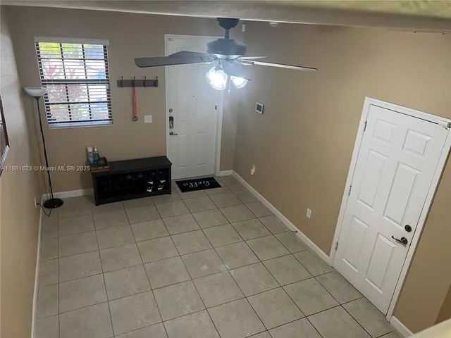 a kitchen with a sink and a stove top oven with wooden floor