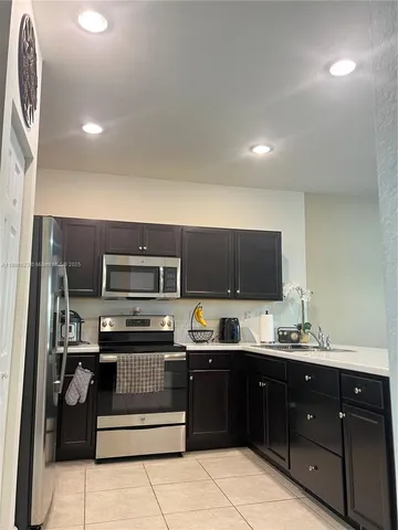 a view of a dining room with furniture and window