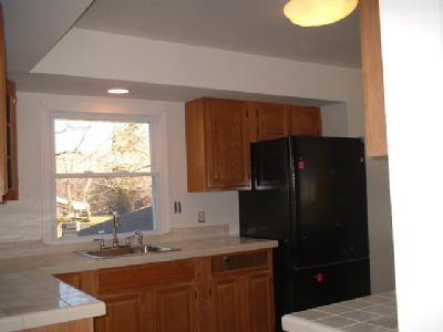 4295 Lower Saucon Road Hellertown, PA 18055 - Photo 11 of 12 a kitchen with a sink a refrigerator and window