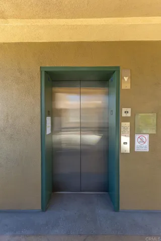 a lobby with furniture and a potted plant