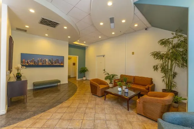 a front view of a building with potted plants