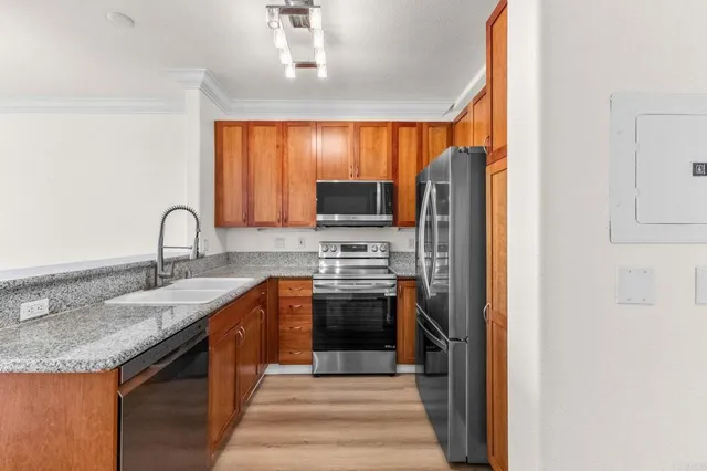 a spacious bathroom with a granite countertop tub sink and mirror
