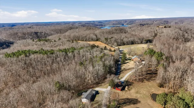 a view of a livingroom with a ceiling fan and wooden floor