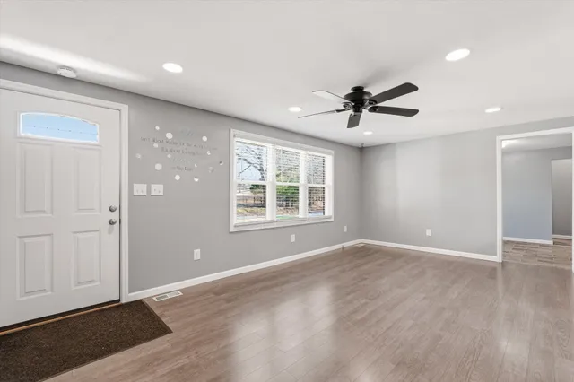 a view of kitchen with cabinets and wooden floor