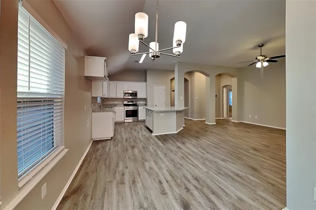 a view of house with backyard and deck