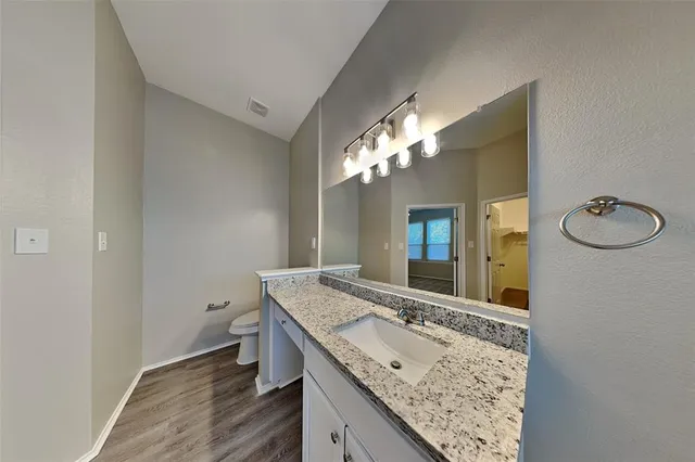 a view of a livingroom with a ceiling fan and window
