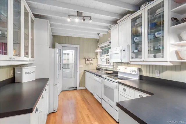 a kitchen with stainless steel appliances granite countertop a stove and a sink
