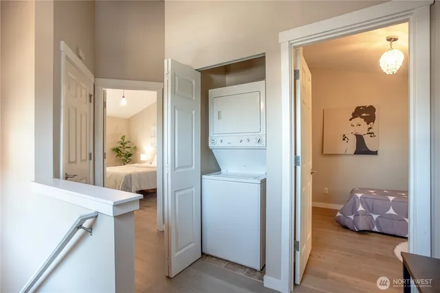 a bedroom with a bed lamp and a window