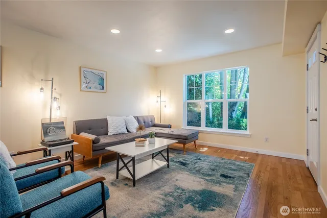 a living room with furniture and a window