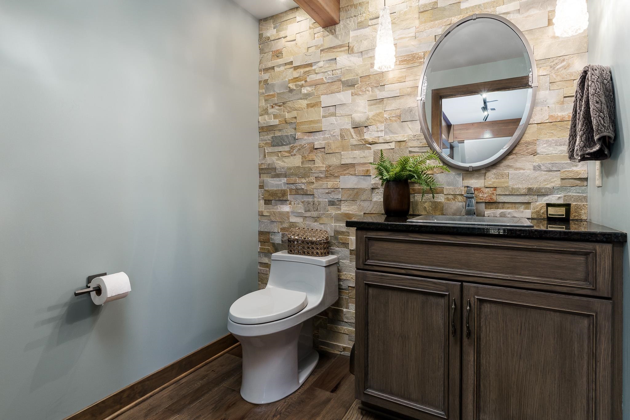 13345 Russellville Road Capron, IL 61012 - Photo 54 of 92 a bathroom with a toilet sink vanity and mirror