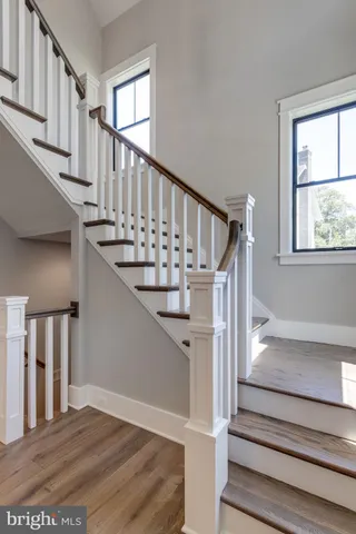 a room with wooden floor and a window