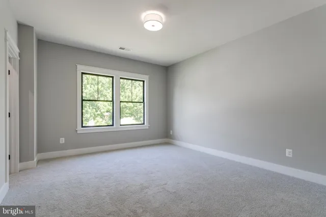 a bathroom with a granite countertop toilet sink and bathtub