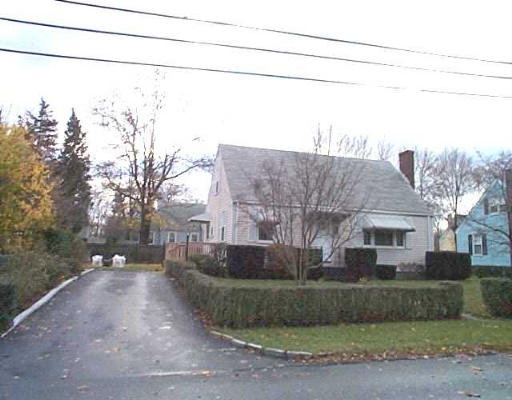 a view of a house with a street
