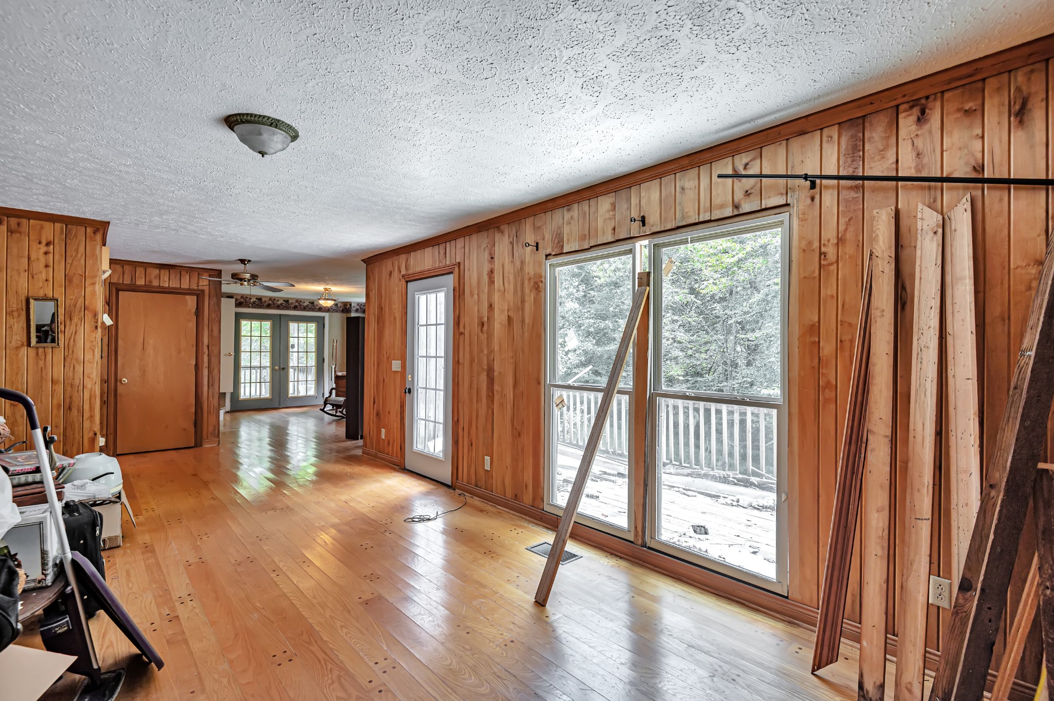 450 Womack Road Portland, TN 37148 - Photo 17 of 22 a view of an empty room with wooden floor and a window