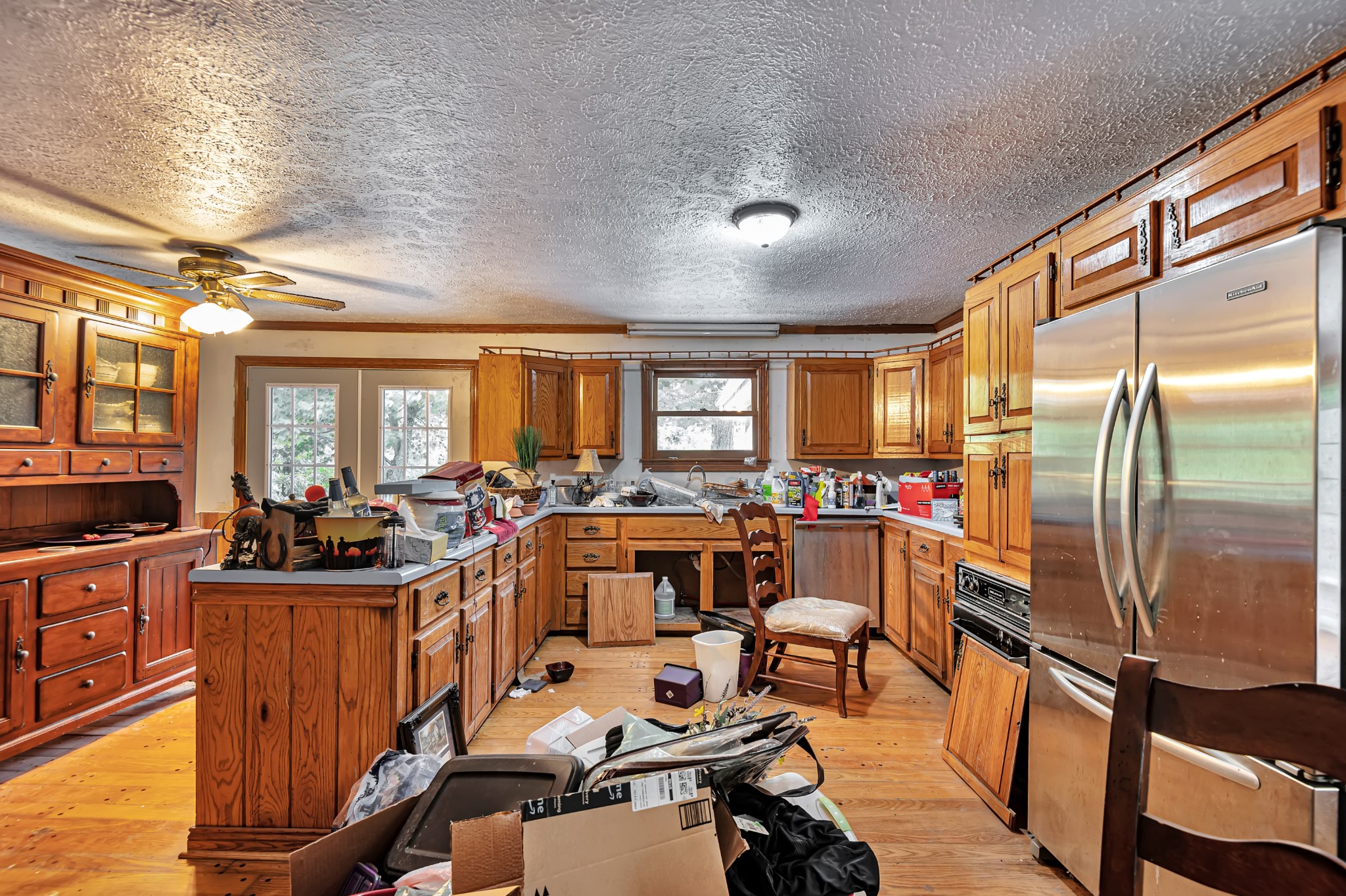 450 Womack Road Portland, TN 37148 - Photo 3 of 22 a view of a dining room with furniture a kitchen view and a large window