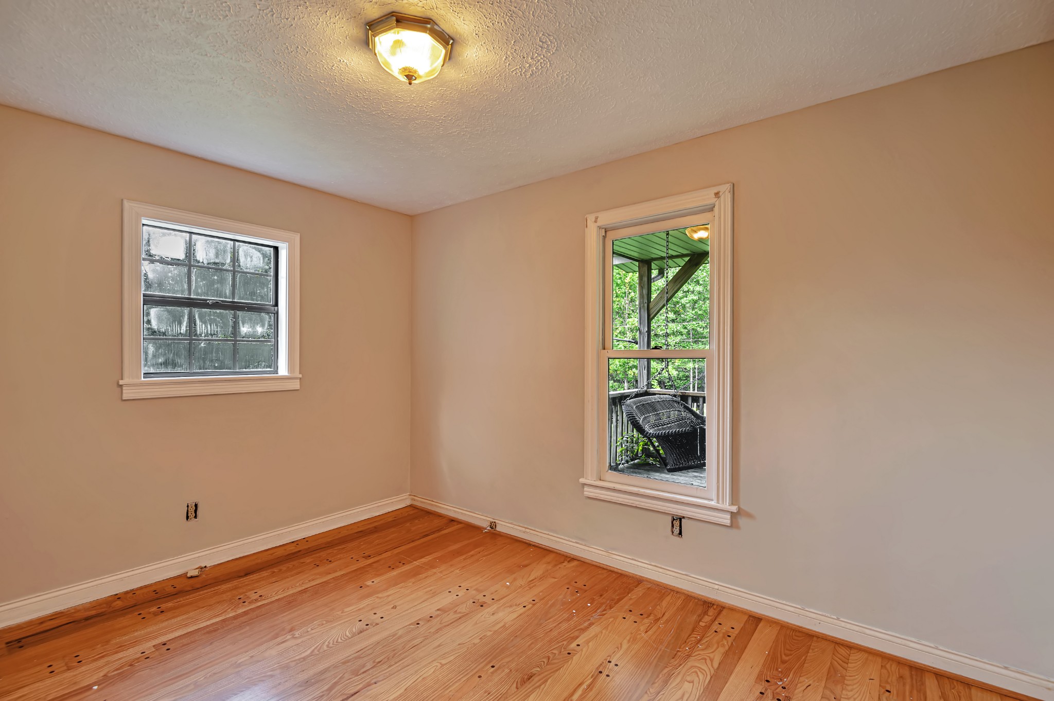 450 Womack Road Portland, TN 37148 - Photo 10 of 22 a view of an empty room with wooden floor and a window