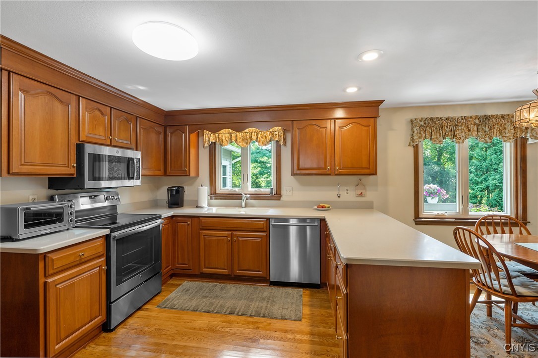 4318 Cinnamon Path Clay, NY 13090 - Photo 13 of 50 Gleaming stainless steel appliances have been upda
