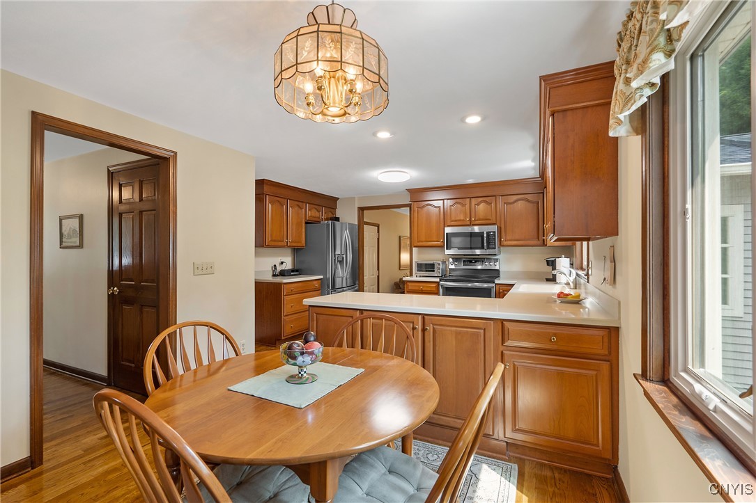 4318 Cinnamon Path Clay, NY 13090 - Photo 18 of 50 Stepping out from the laundry/half bath hall, the