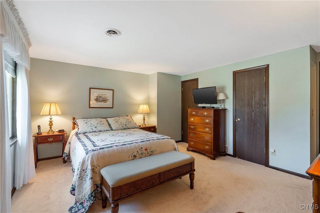 4318 Cinnamon Path Clay, NY 13090 - Photo 28 of 50 Two closets flank a wall area that begs for a tall