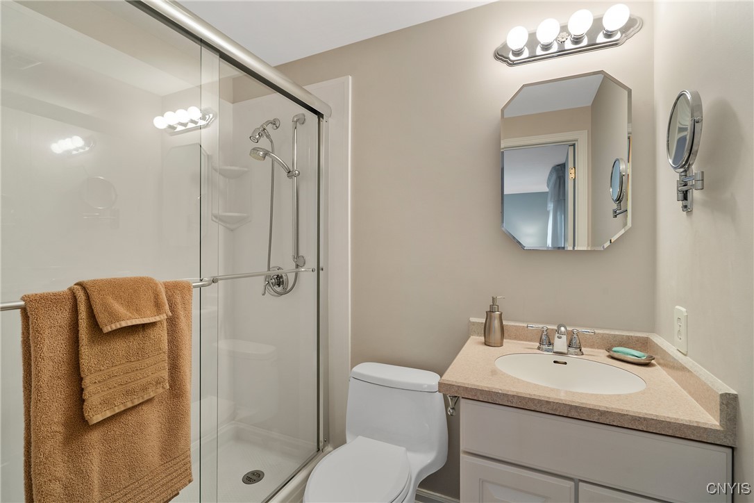 4318 Cinnamon Path Clay, NY 13090 - Photo 30 of 50 Stepping into the full bath, we see a modern showe