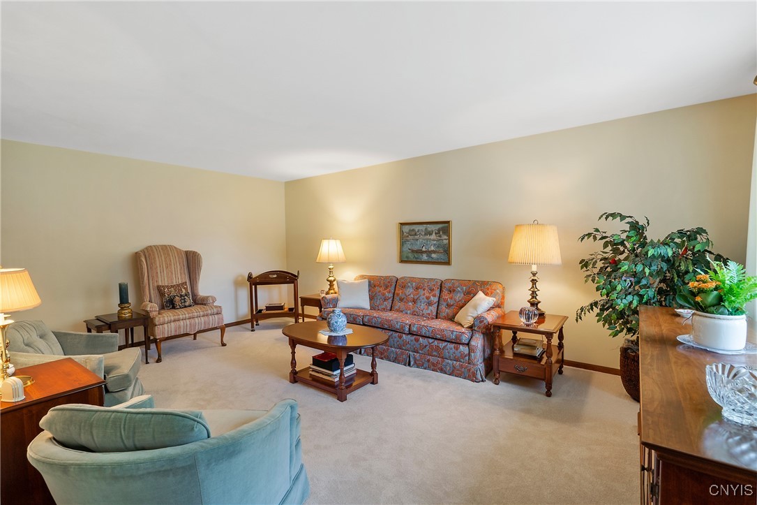 4318 Cinnamon Path Clay, NY 13090 - Photo 6 of 50 The light-colored carpet adds a touch of formality