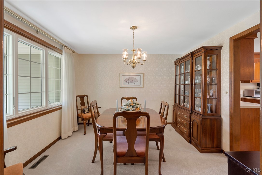 4318 Cinnamon Path Clay, NY 13090 - Photo 8 of 50 Across the foyer, we find a similarly well-lit for