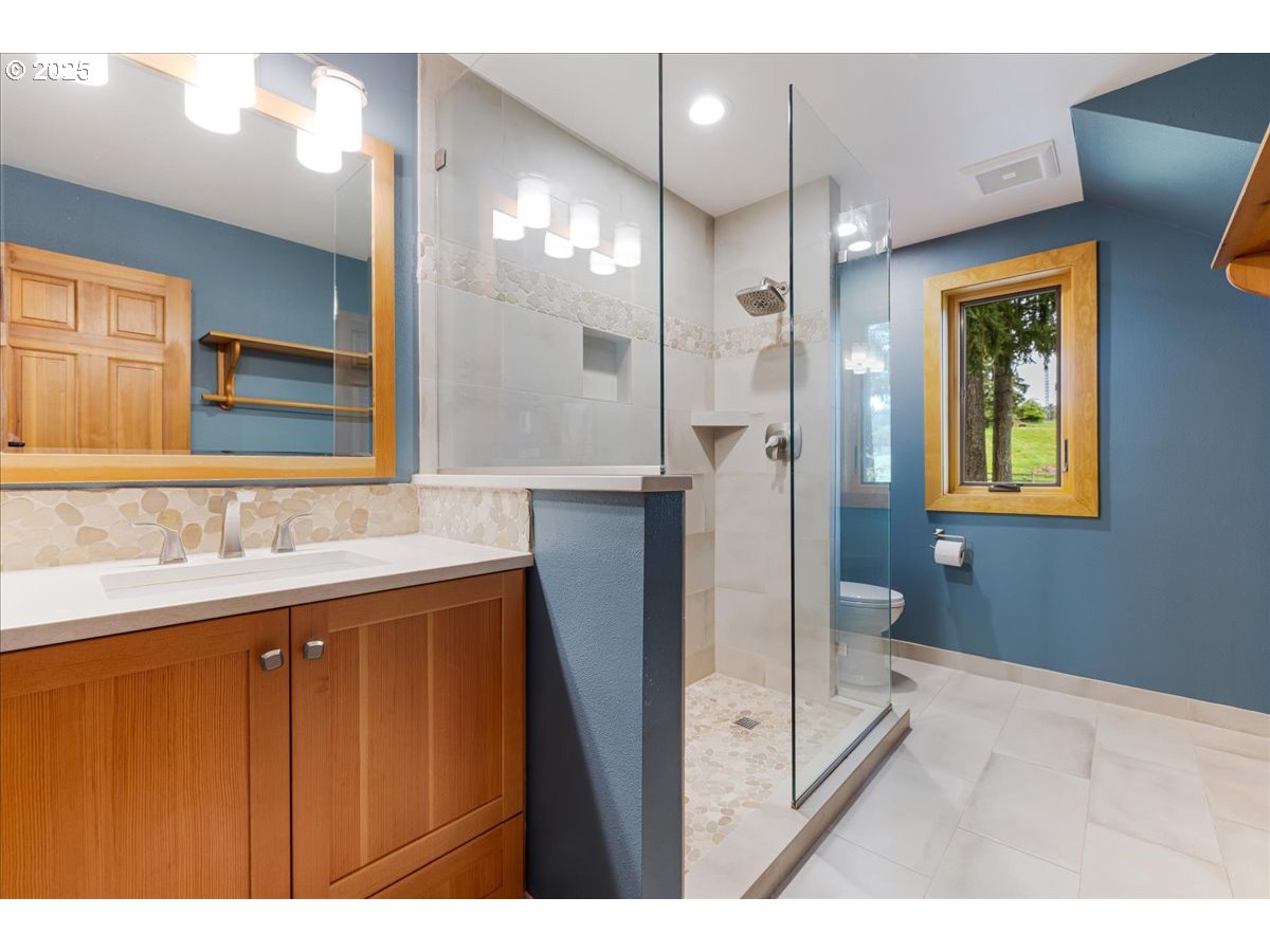 18258 South Dillman Road Oregon City, OR 97045 - Photo 17 of 43 a bathroom with a sink and a mirror